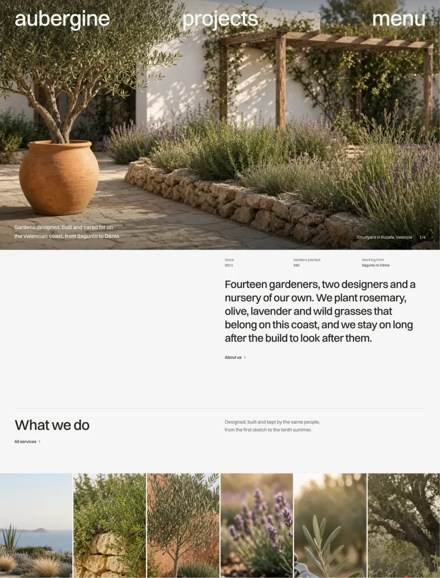 Aubergine home page with a photo hero of a garden courtyard